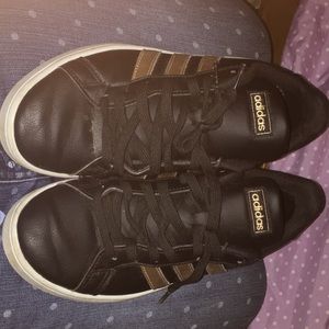 Black and gold adidas